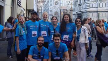 Group photo of students standing in front of an iconic building in Florence, Italy