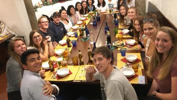 Group photo of students have dinner in Florence, Italy