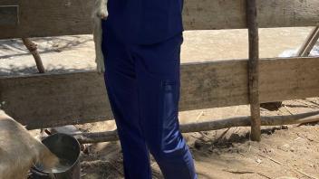 student holding an animal